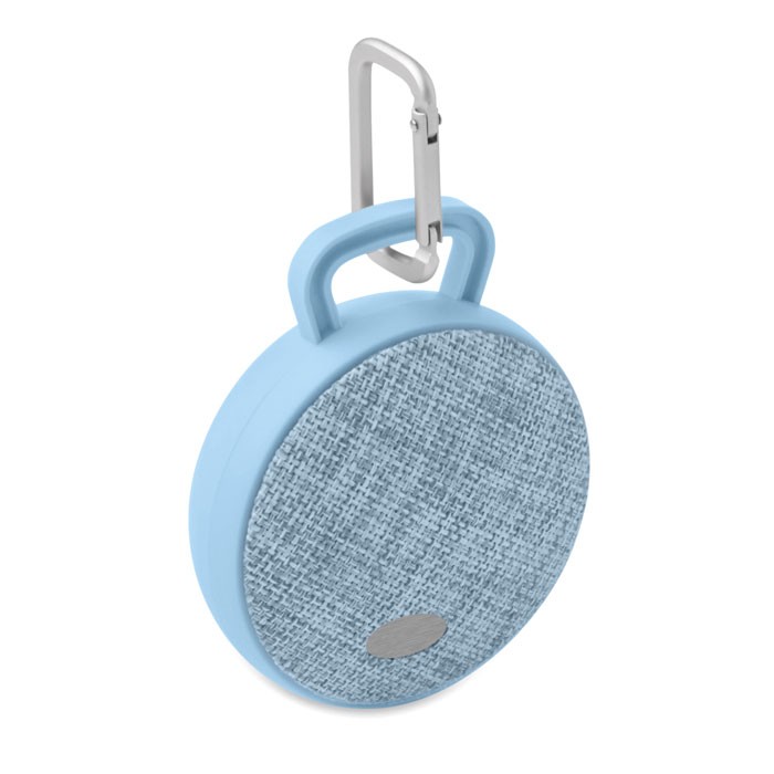 ROLL Haut-parleur publicité rond Bluetooth avec revêtement en tissu sur le devant et finition en caoutchouc.